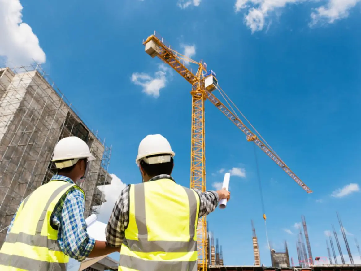 Client-side advisors reviewing construction planning documents in Sri Lanka